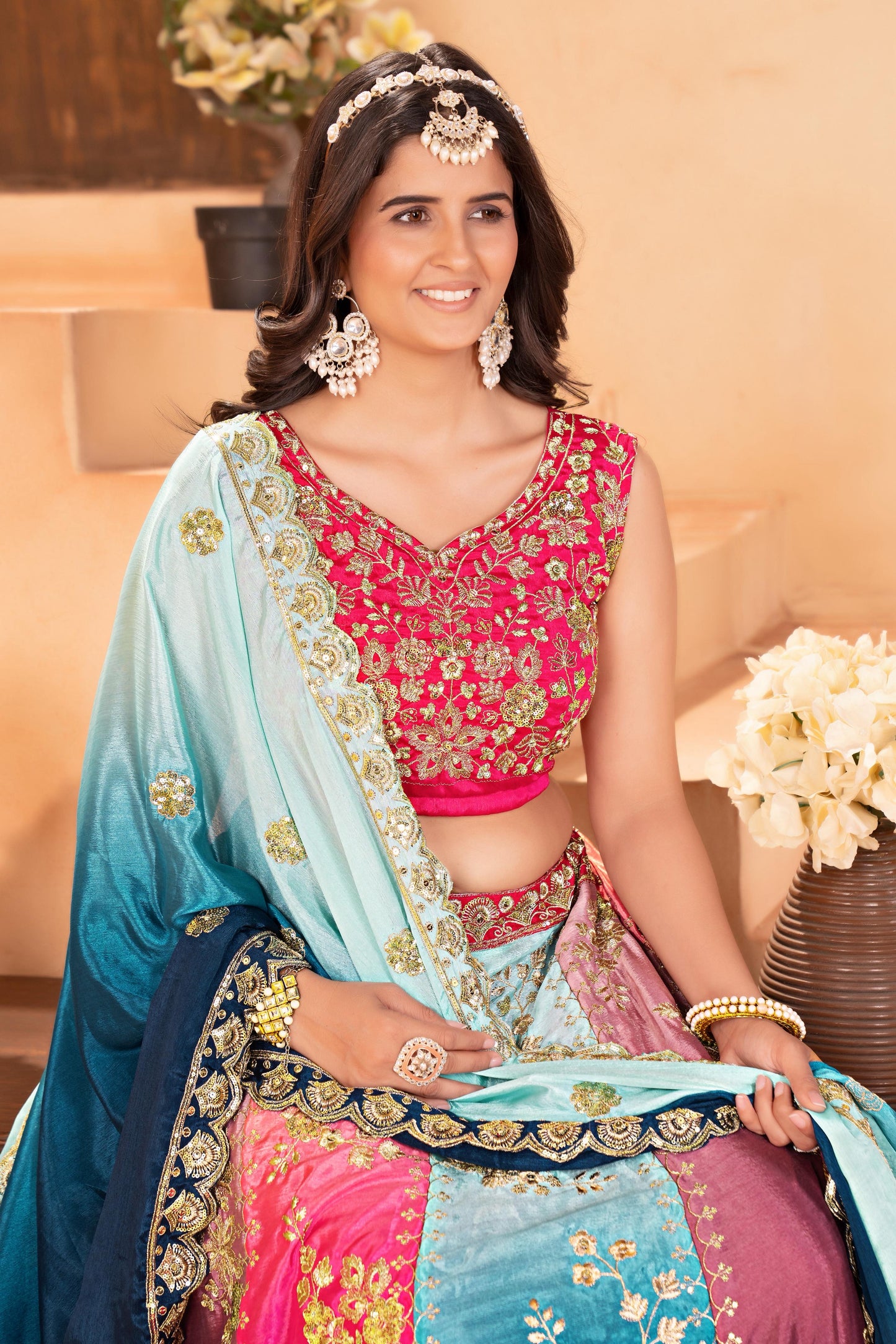 Vibrant multi colored lehenga with intricate silver embroidery