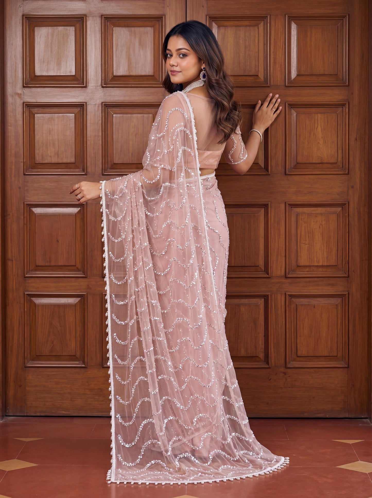 Designer handwork net saree with pearl tassles