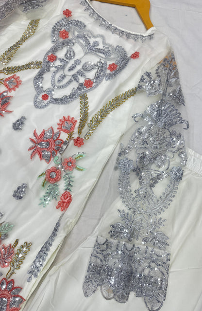 Ivory charm with delicate silver embroidery suit