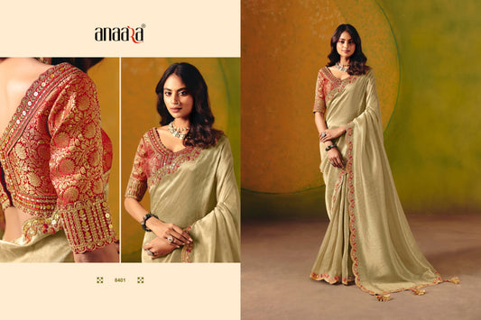 Elegant pastel designer saree adorned with rich embroidery and sequin highlights for a premium festive look