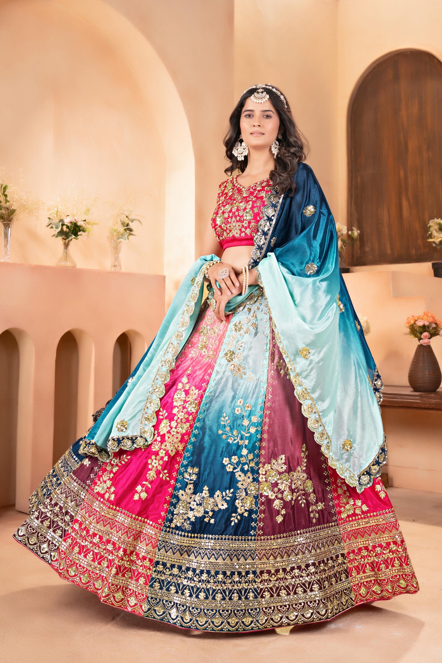 Vibrant multi colored lehenga with intricate silver embroidery