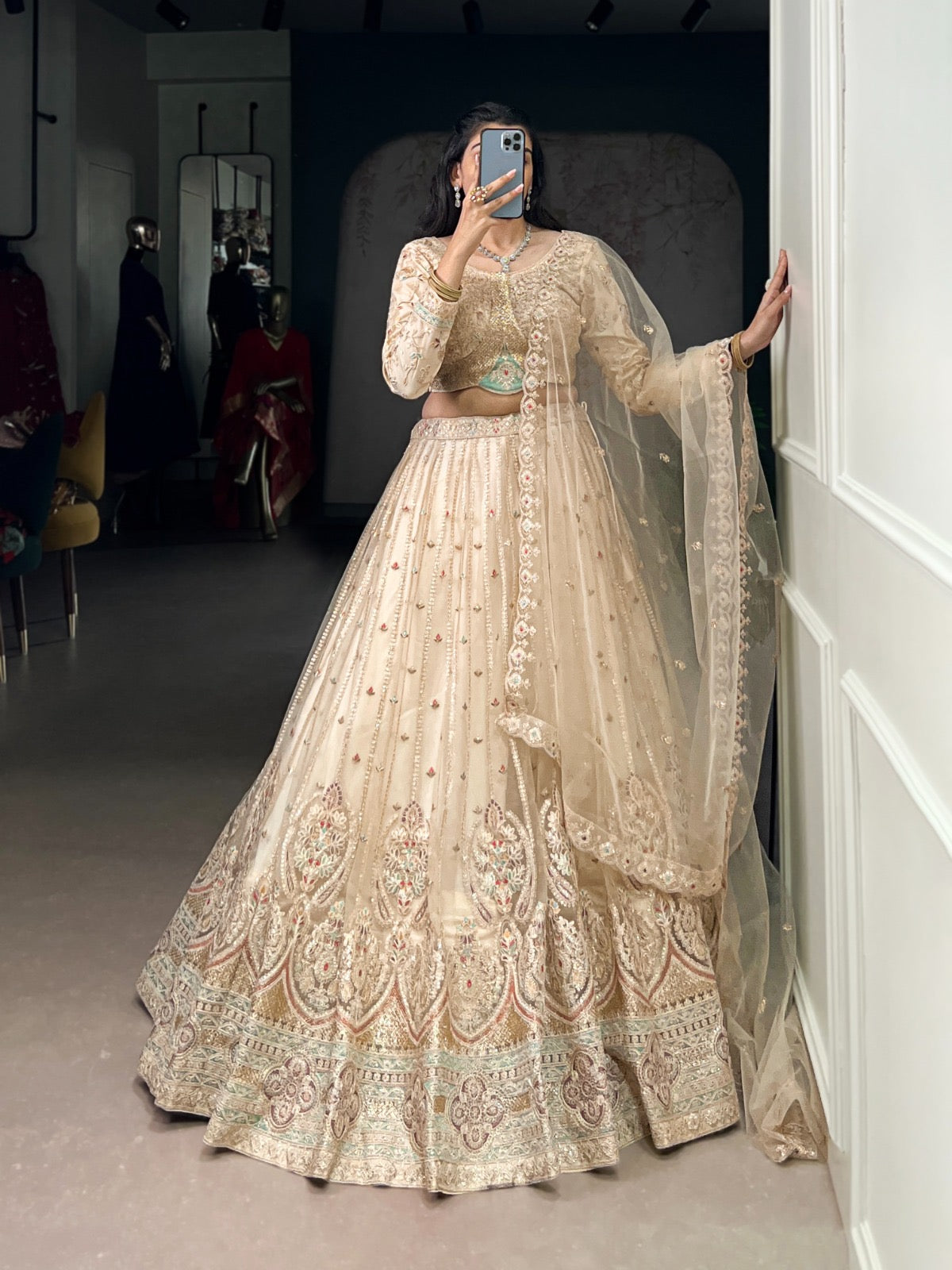 This pastel lehenga choli is a masterpiece of intricate embroidery and timeless elegance, crafted to make every celebration unforgettable