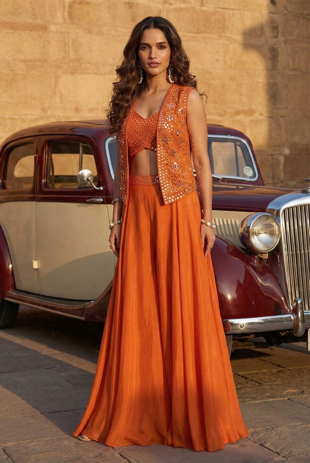 Sunset-orange mirrored koti and flared lehenga set
