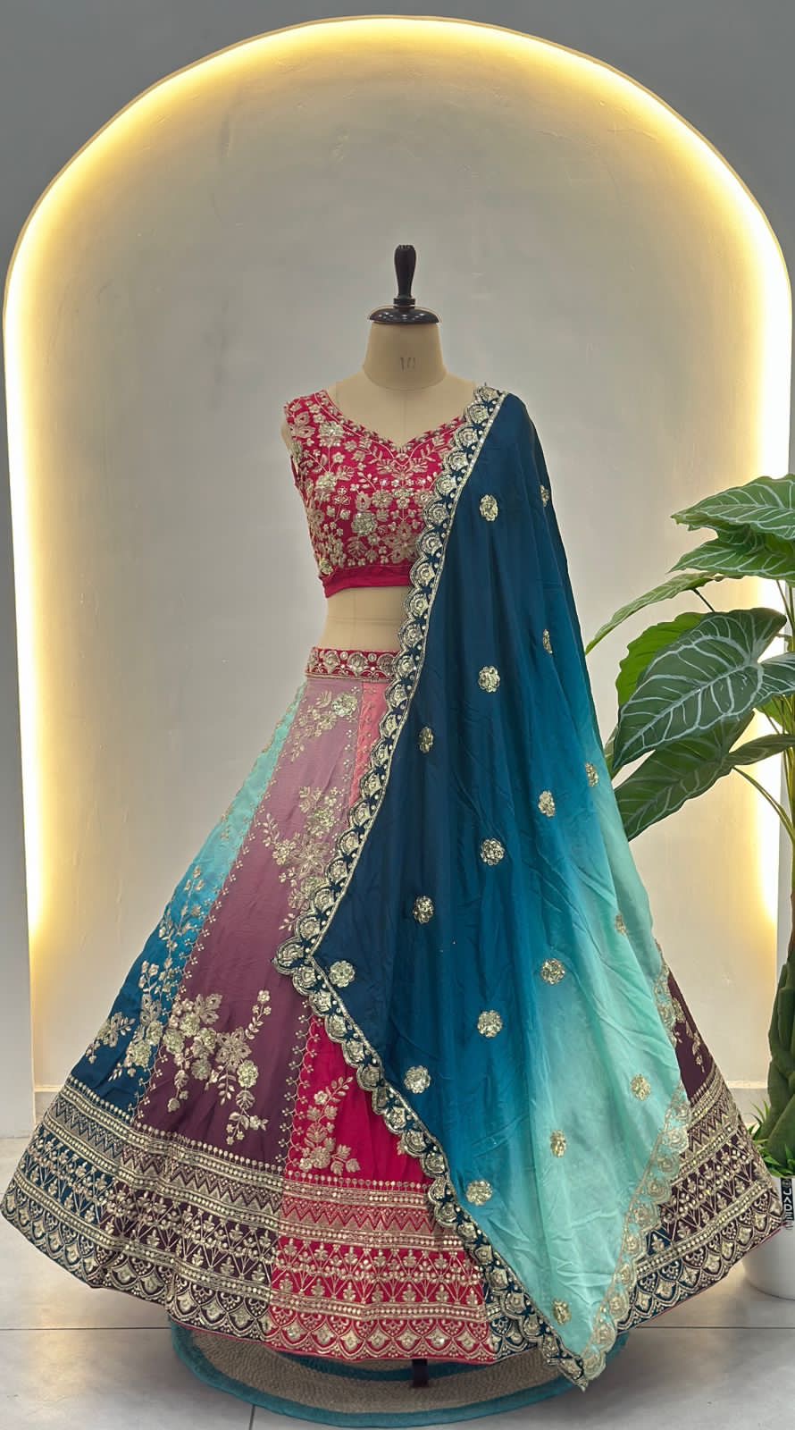 Vibrant multi colored lehenga with intricate silver embroidery