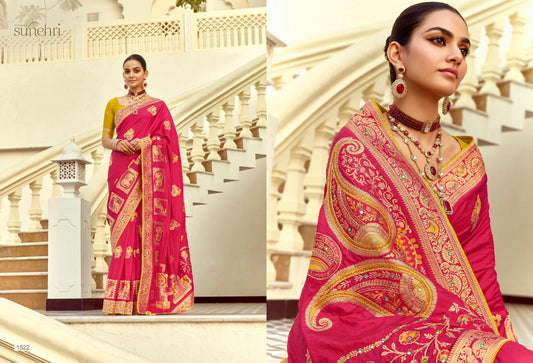 Model wearing a magenta Dola silk saree with gold-toned paisley motifs, an ornate border and a yellow contrast blouse.