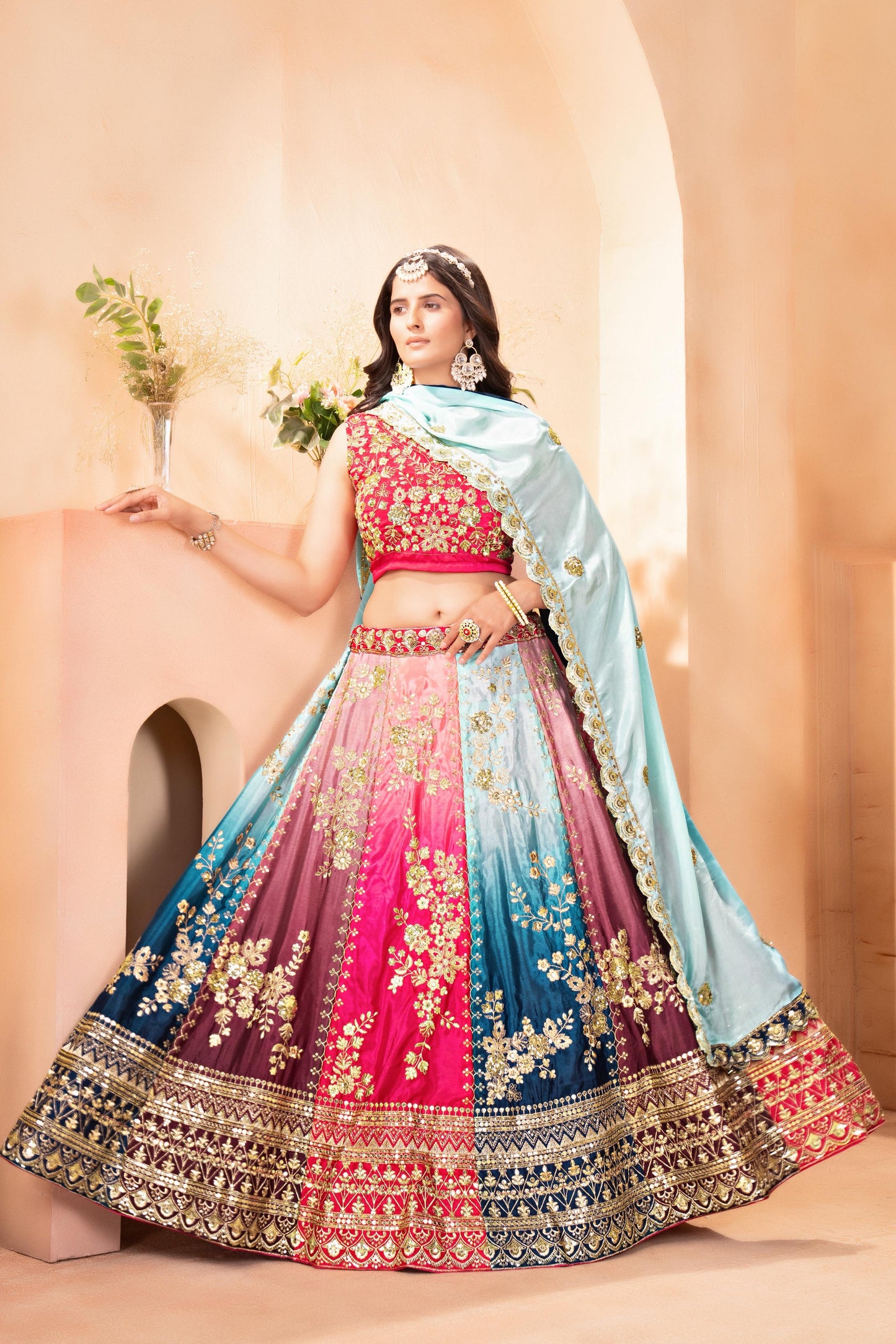Vibrant multi colored lehenga with intricate silver embroidery