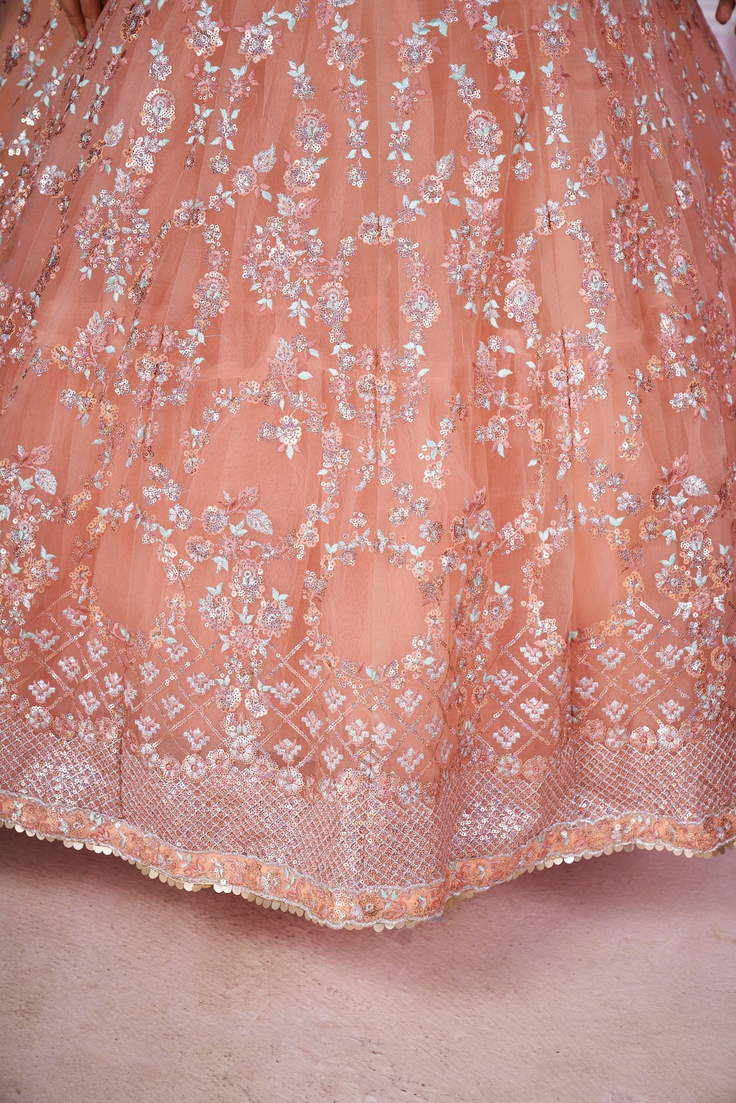 Peach Pink Embroidered Net Lehenga Choli