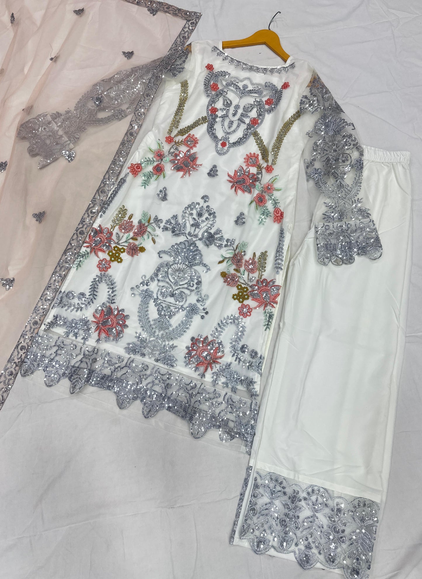Ivory charm with delicate silver embroidery suit