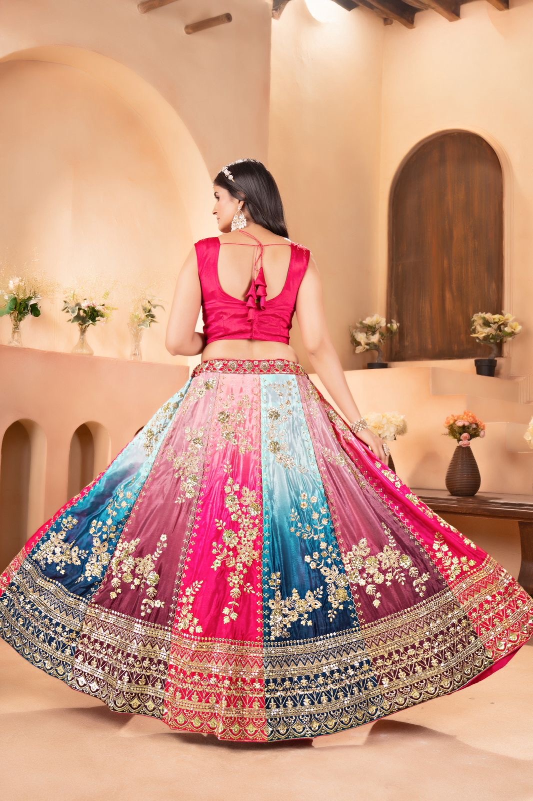 Vibrant multi colored lehenga with intricate silver embroidery
